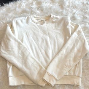 Size small HM cream sweatshirt with shoulder pads